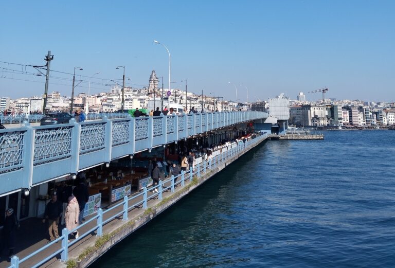 Galata Bridge connecting Eminonu and Karakoy with fishermen and Golden Horn view